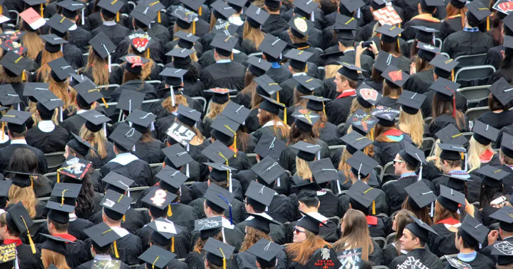 a-large-group-of-graduates-in-black-caps-and-gowns
