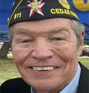 the-us-navy-veteran-philip-turner-wearing-a-hat-with-a smile